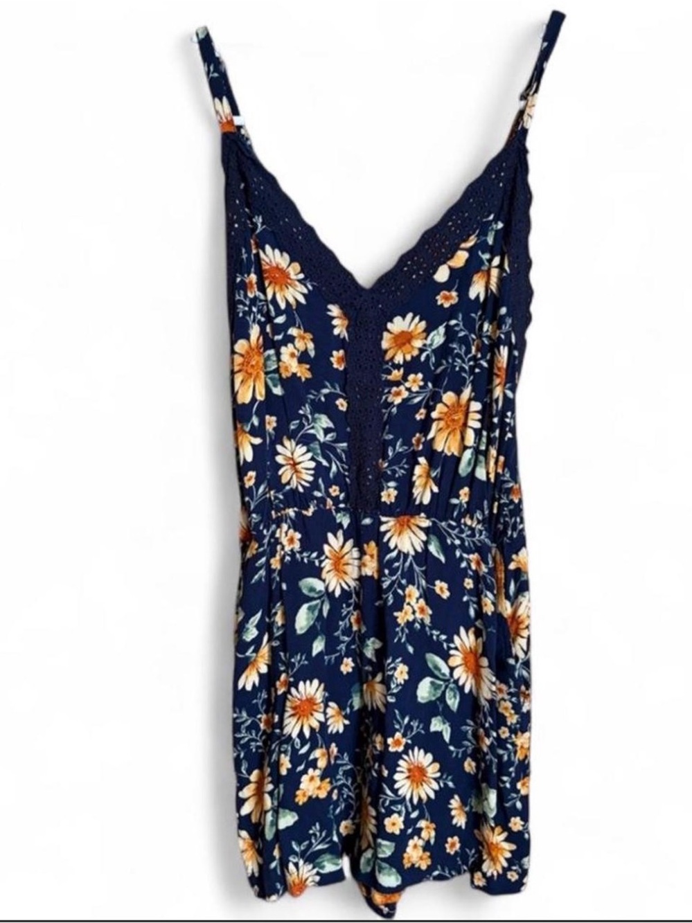Women’s Floral romper adjustable straps blue with pockets roughly size small